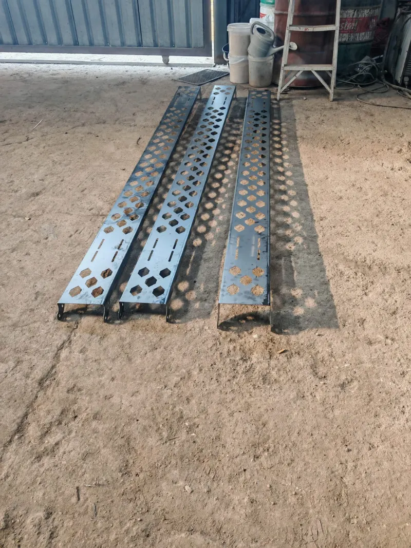 Laser-cut steel loading ramps with perforated pattern