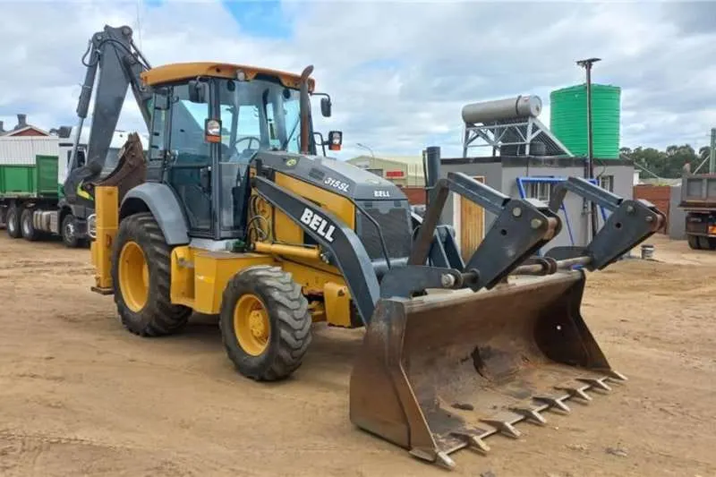 Bell 315SL backhoe loader parked on site