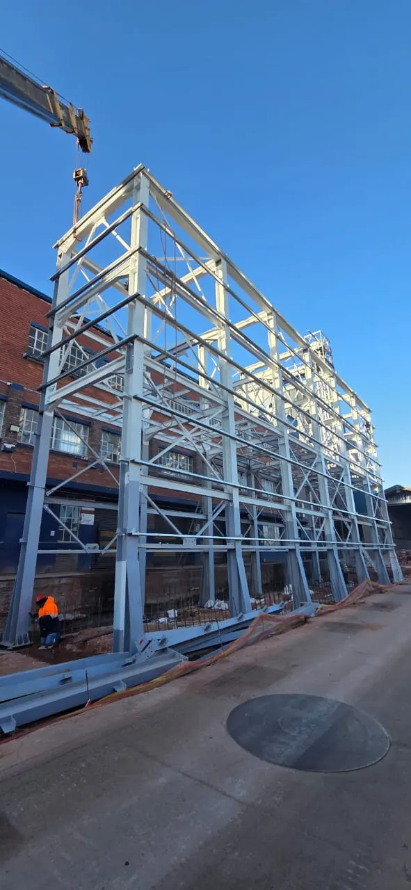 Multi-storey structural steel frame erection with crane